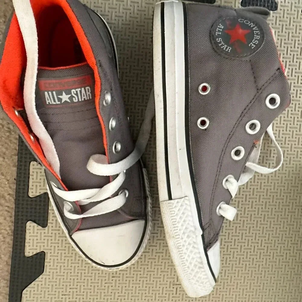Converse All Store Mid Kids shoe. Gray with orange.